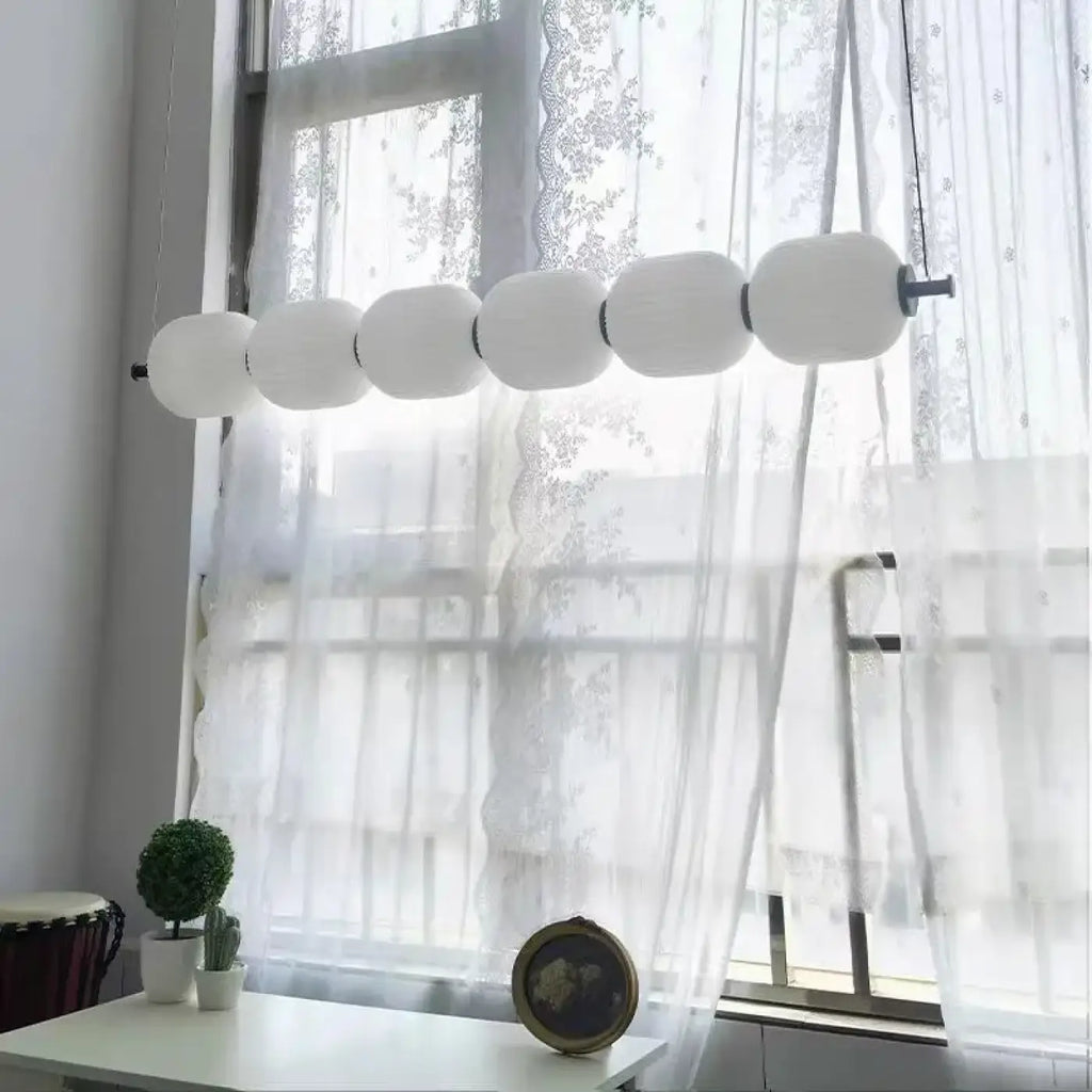 Pendelleuchte Kugeln aus Glas und Messing